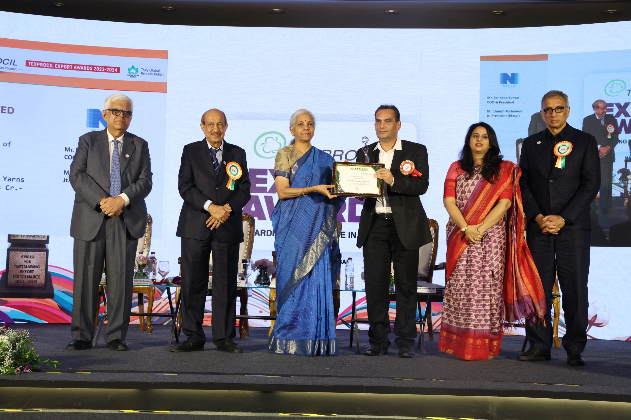 Mr Umesh Toshniwal (Joint  President) Receiving Texprocil Silver Trophy for Second Highest Exports of Grey Yarns in 
the category of Cotton Yarns for the year 2023-24 from honourable Uniion Minister of Finance and Minister of Corporate Affairs Mrs Nirmala Sitharaman